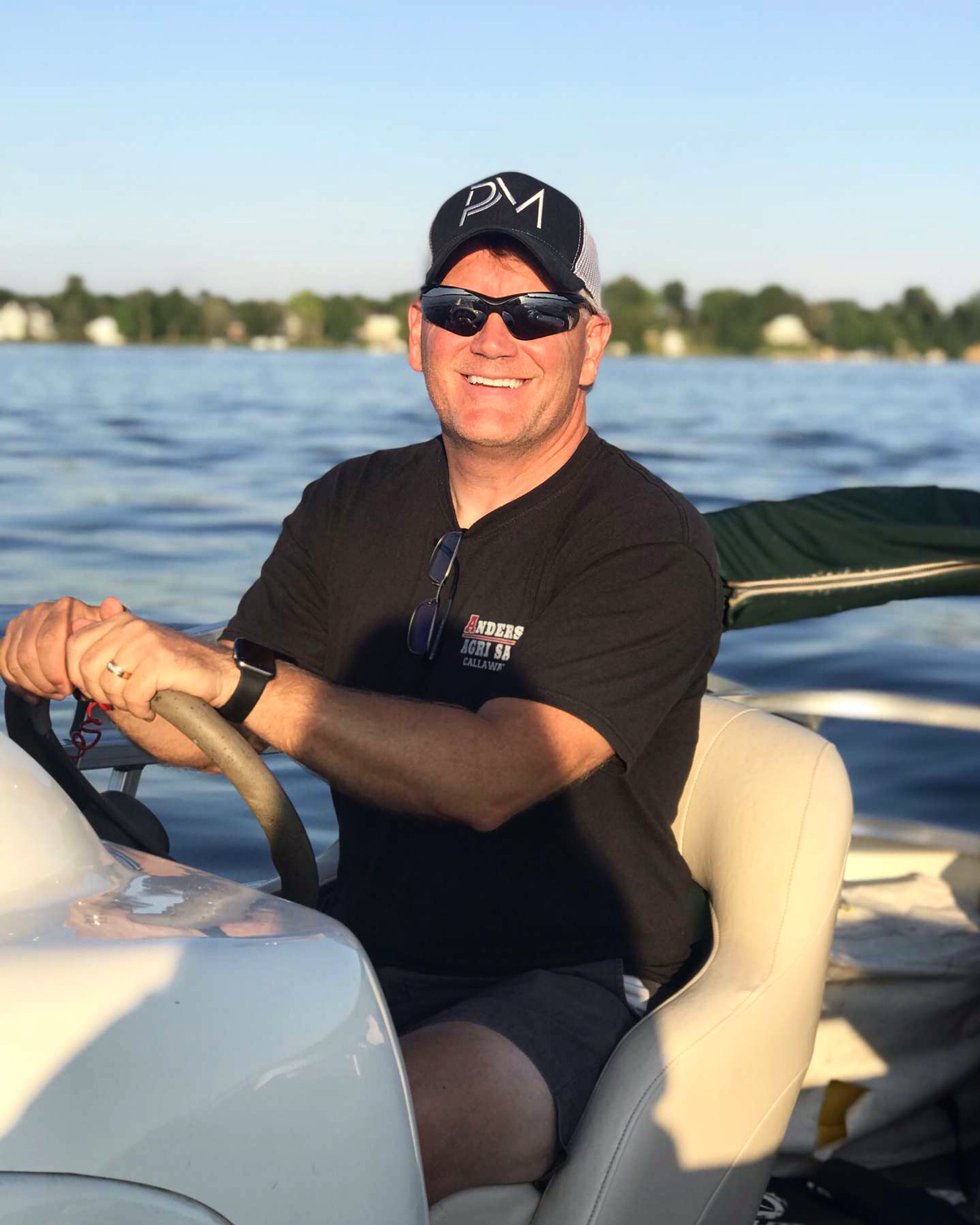 Tim Eggebraaten wearing his 1ED PM hat on the boat
