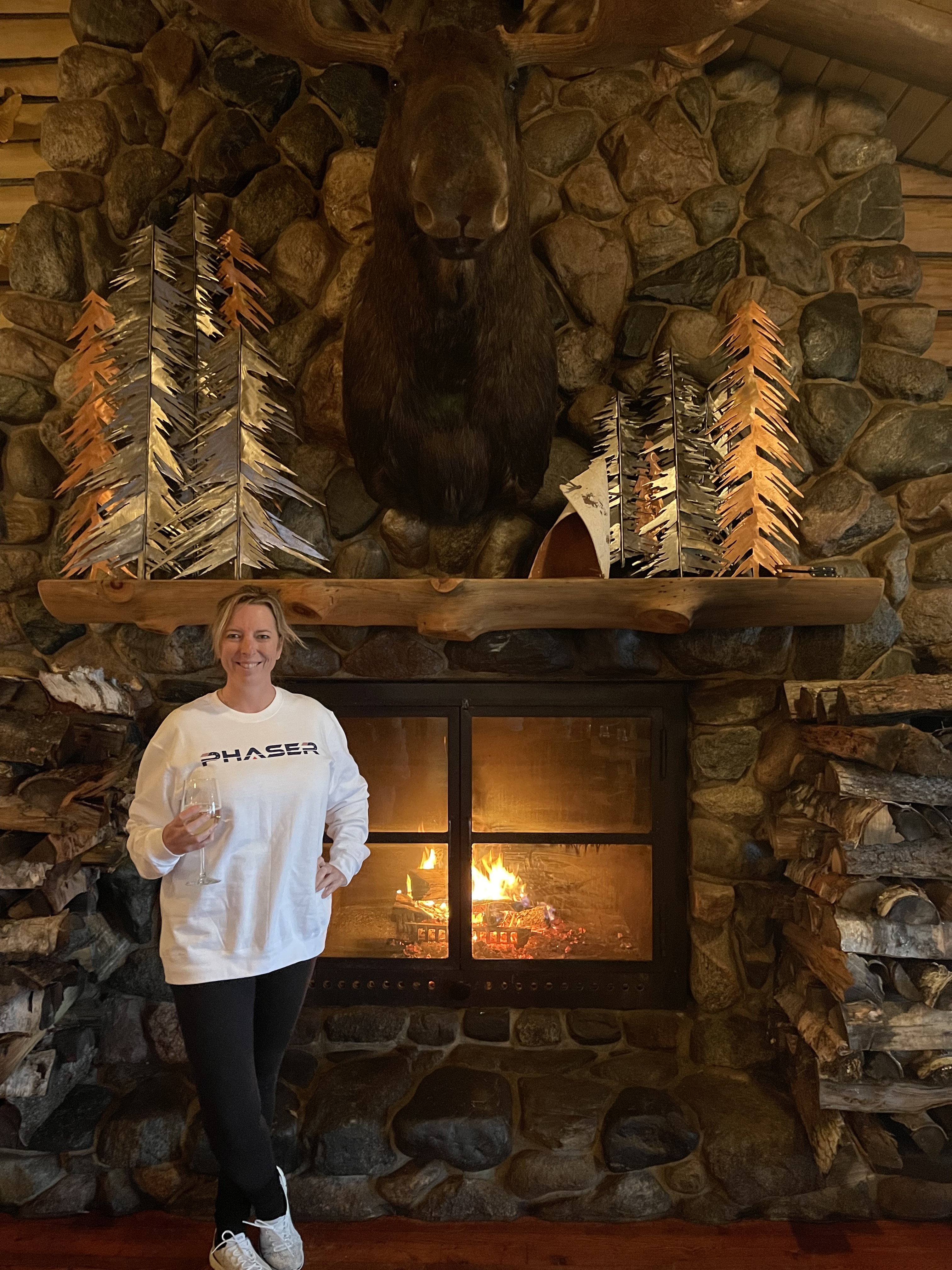 Dionne wearing her Phaser Space Crew next to the fireplace