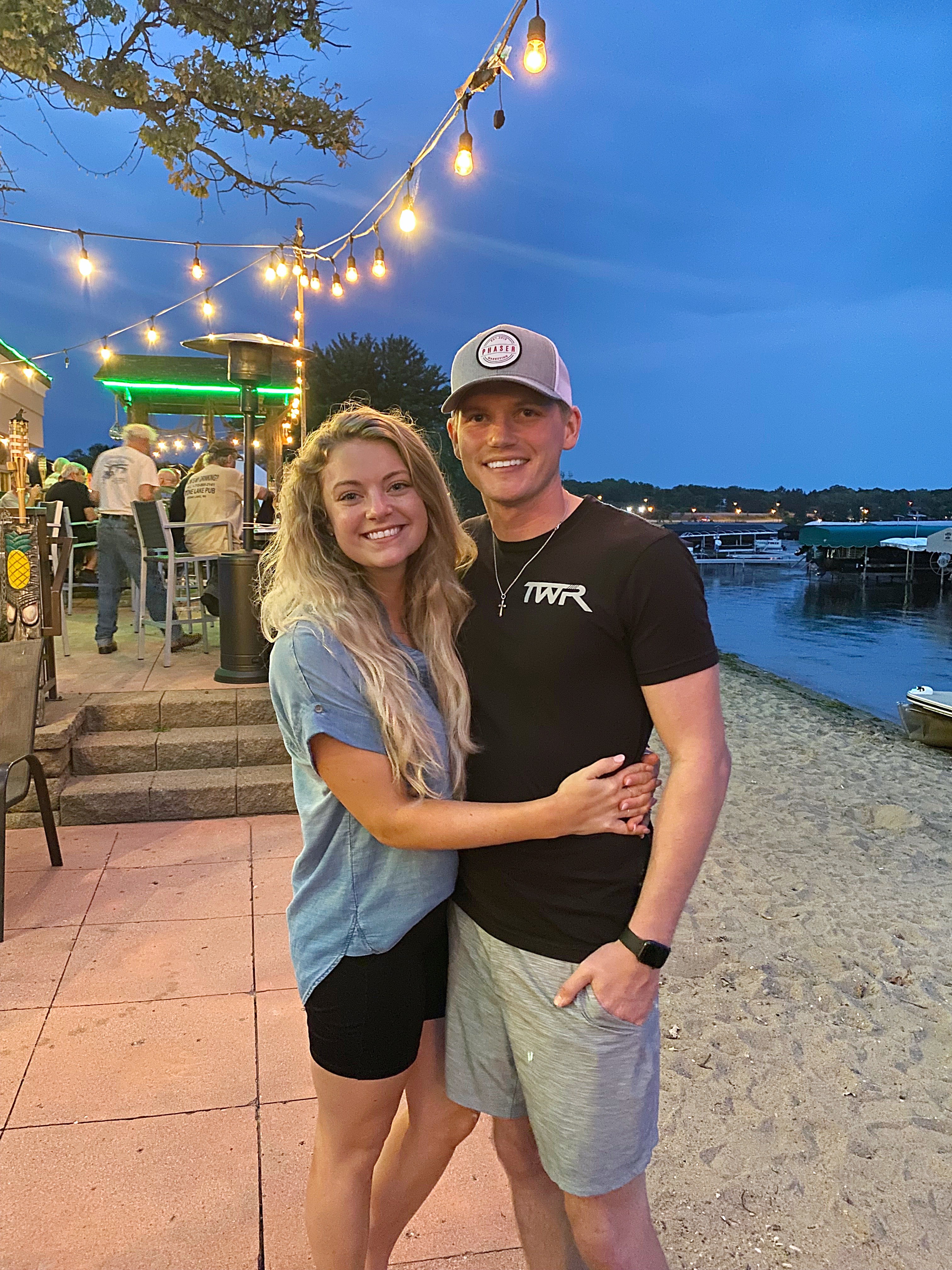 Luke and Olivia outside of the holiday inn in detroit lakes wearing the 3rd edition patch hat