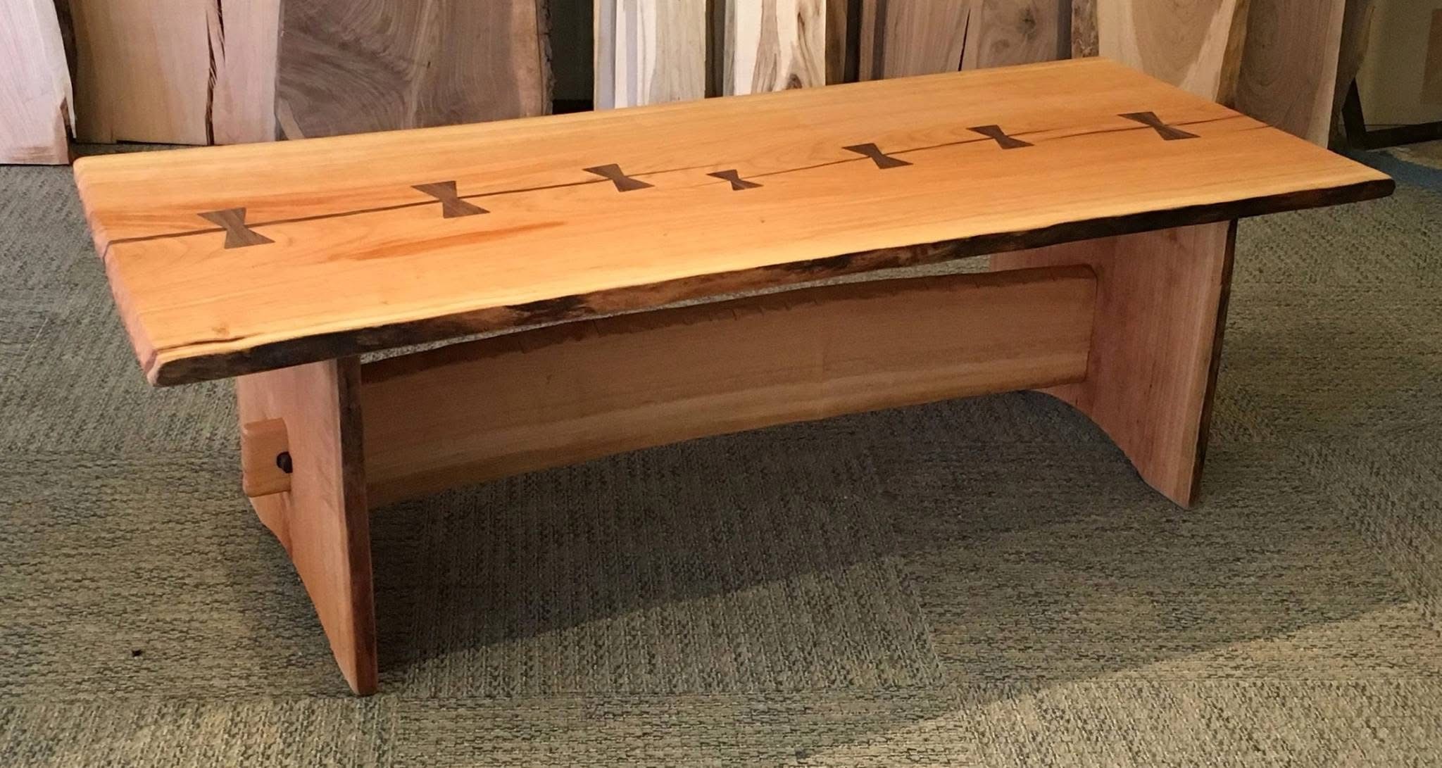 Cherry live edge bench with black walnut butterflies going all the way across the table longways - 7 butterflies in total
