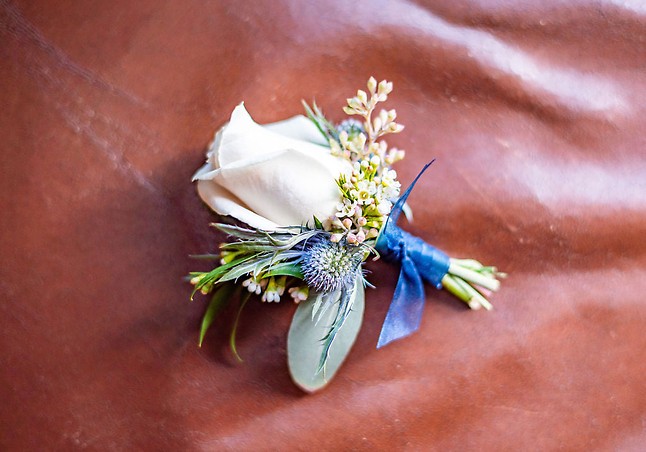 Corsages with thistle and white wax flower