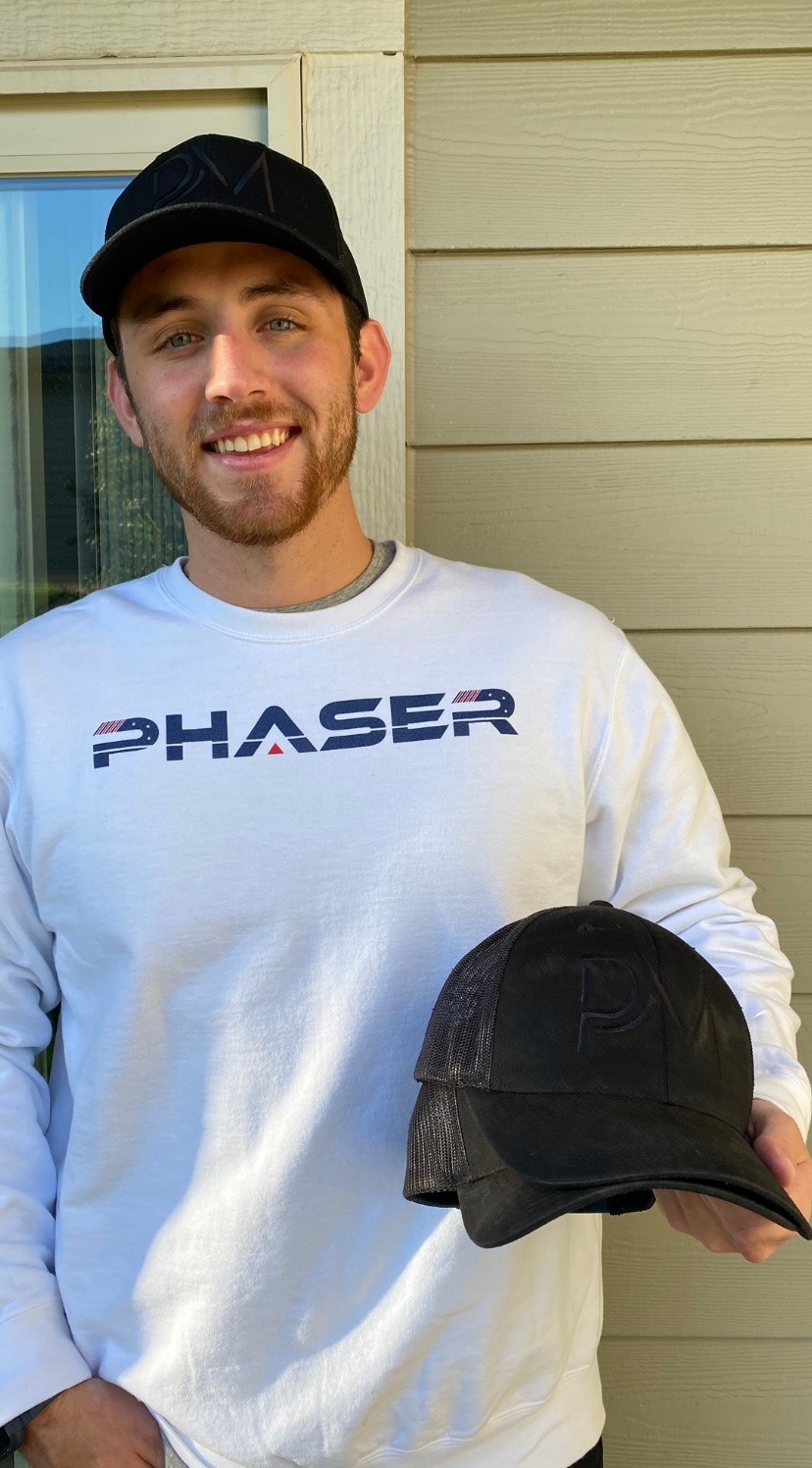 Hunter wearing his Phaser Space Crew Neck and showing his LE 1ED hats