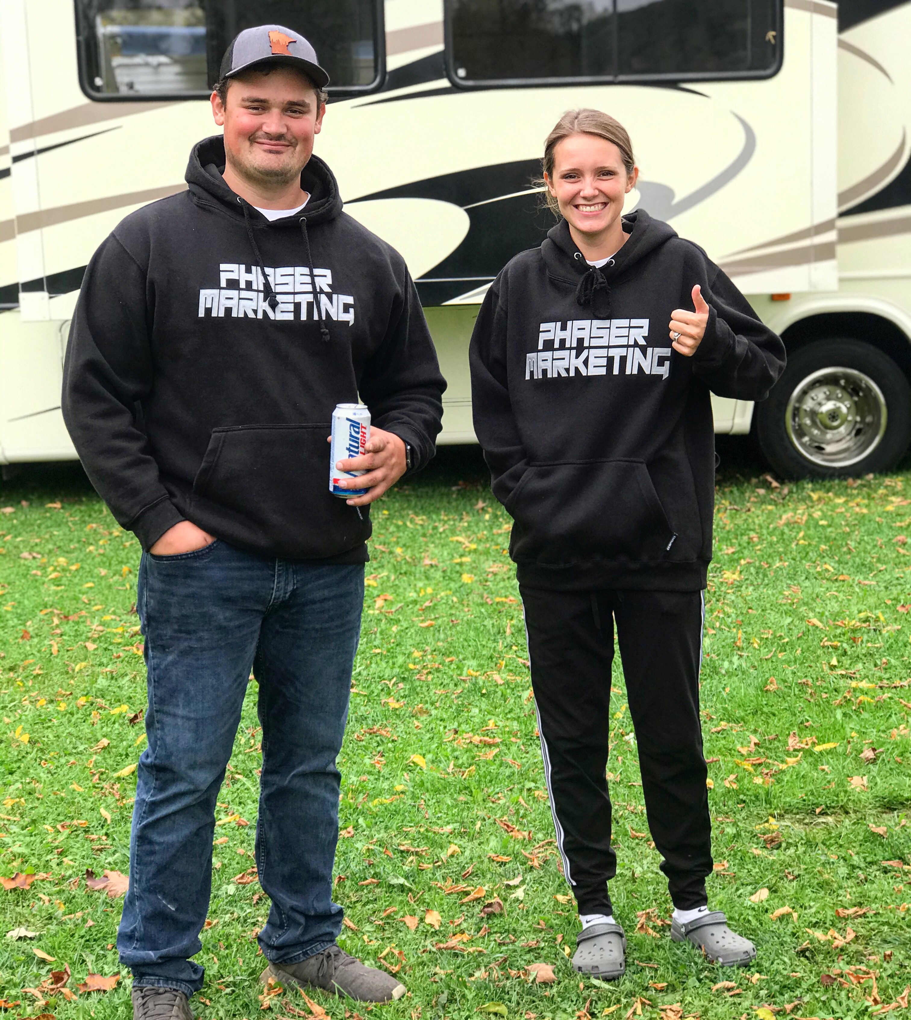 Dylan and Jena wearing their black phaser marketing sweatshirts