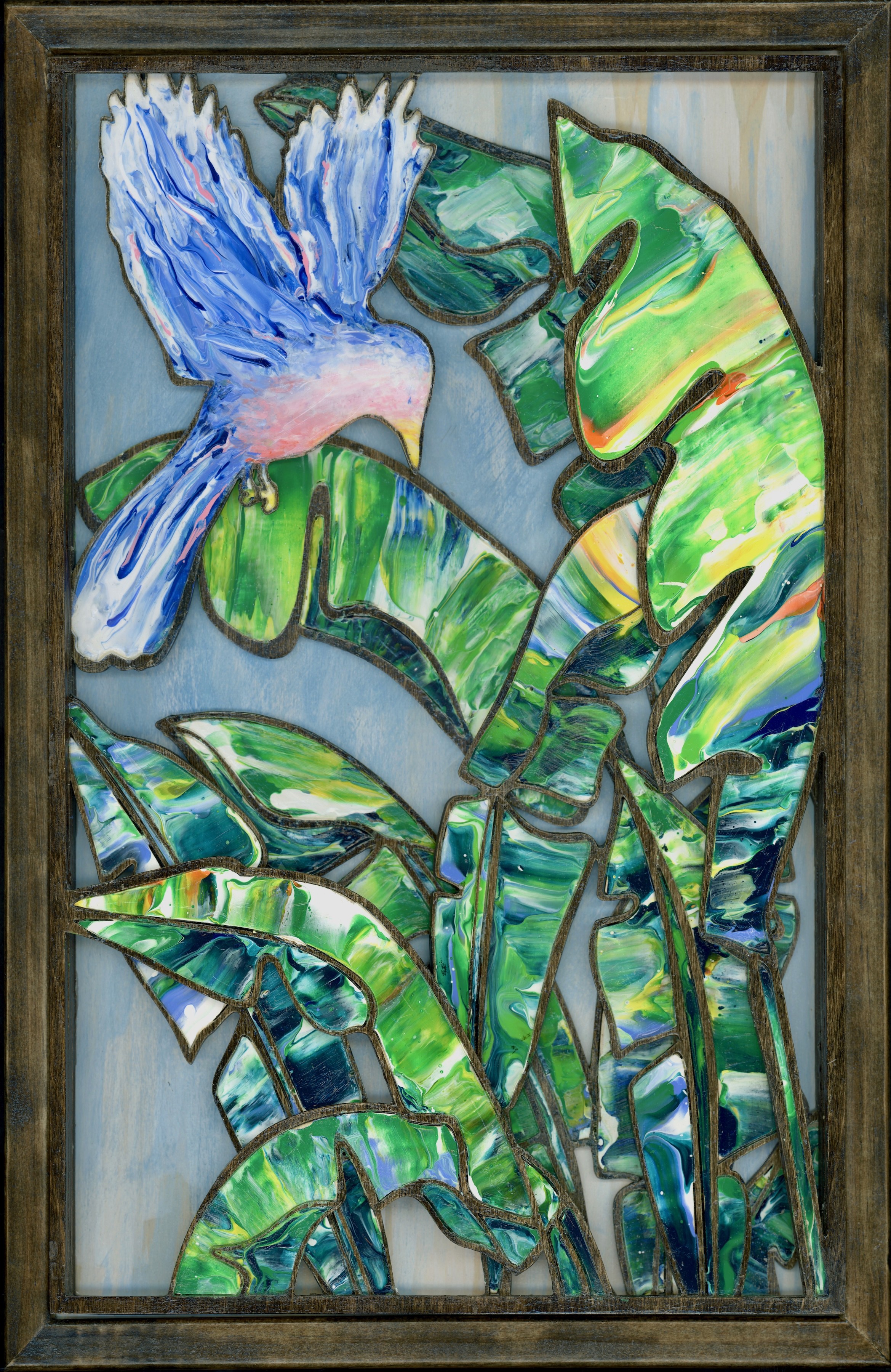 3D wood mosaic sculpture featuring a tropical blue bird emerging from the depths of banana leaves. Created using four panels hand-painted and inlaid to form a cohesive masterpiece then stacked adding depth and intricate shadows. Wood frame 18"x12"x1"