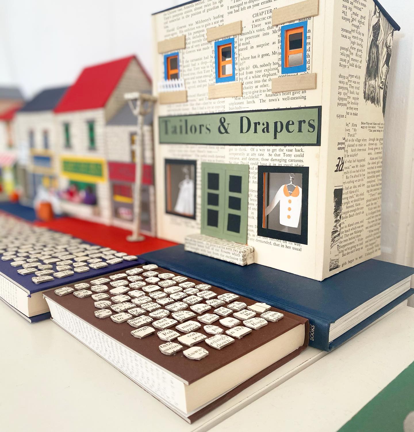 Model houses and shops made from books